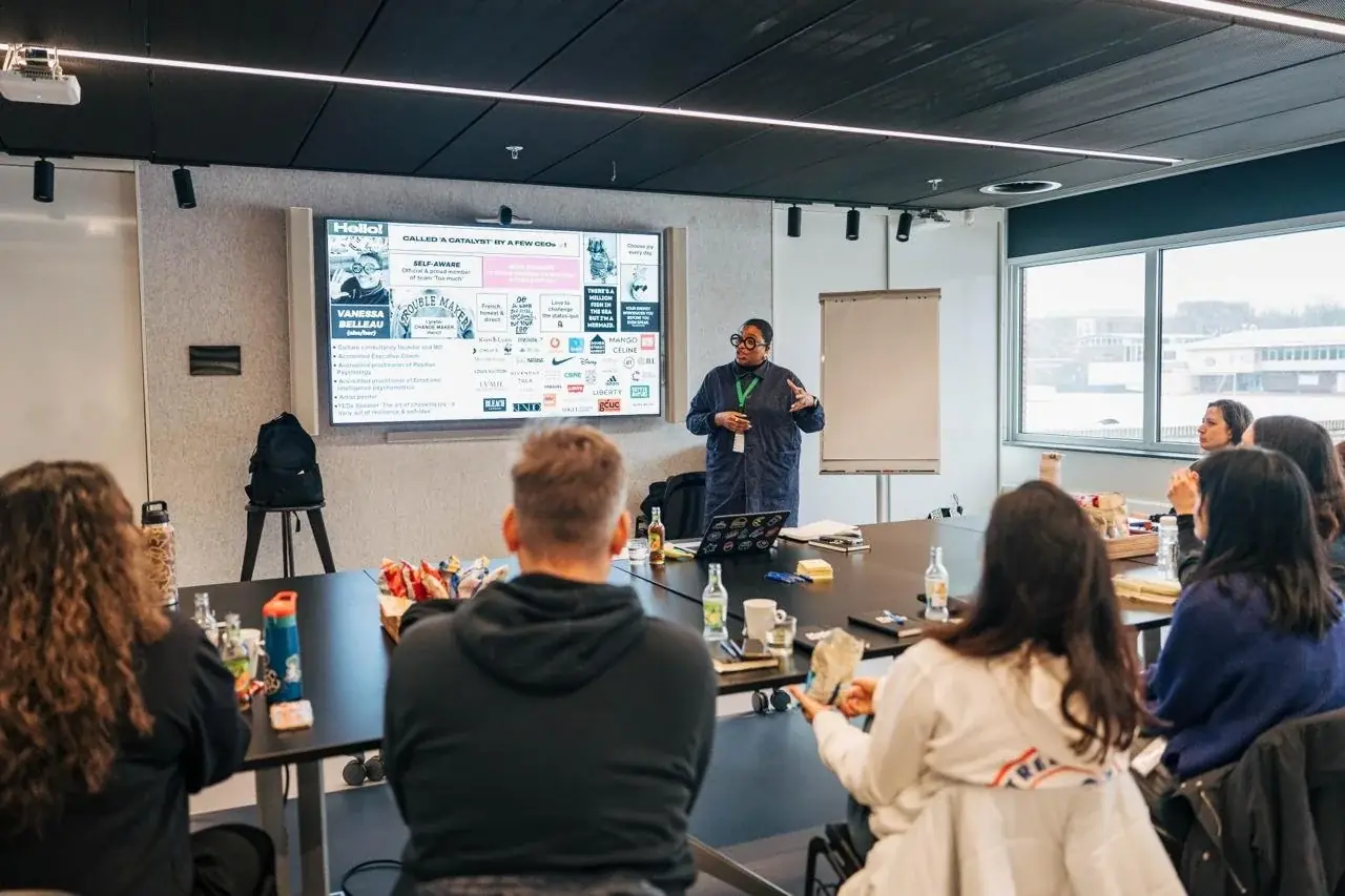 Vanessa delivering a culture workshop to a seated group