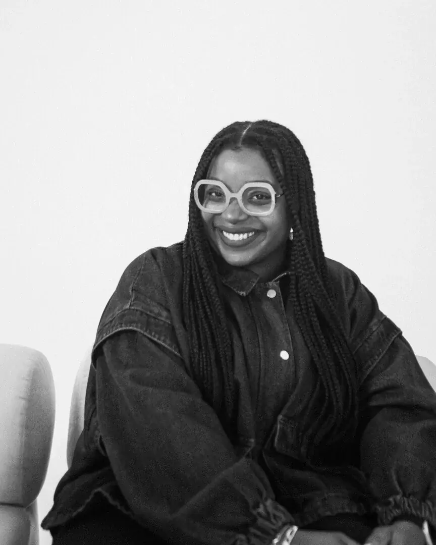 Vanessa Belleau, founder of High Fifteen, smiling in a black and white portrait