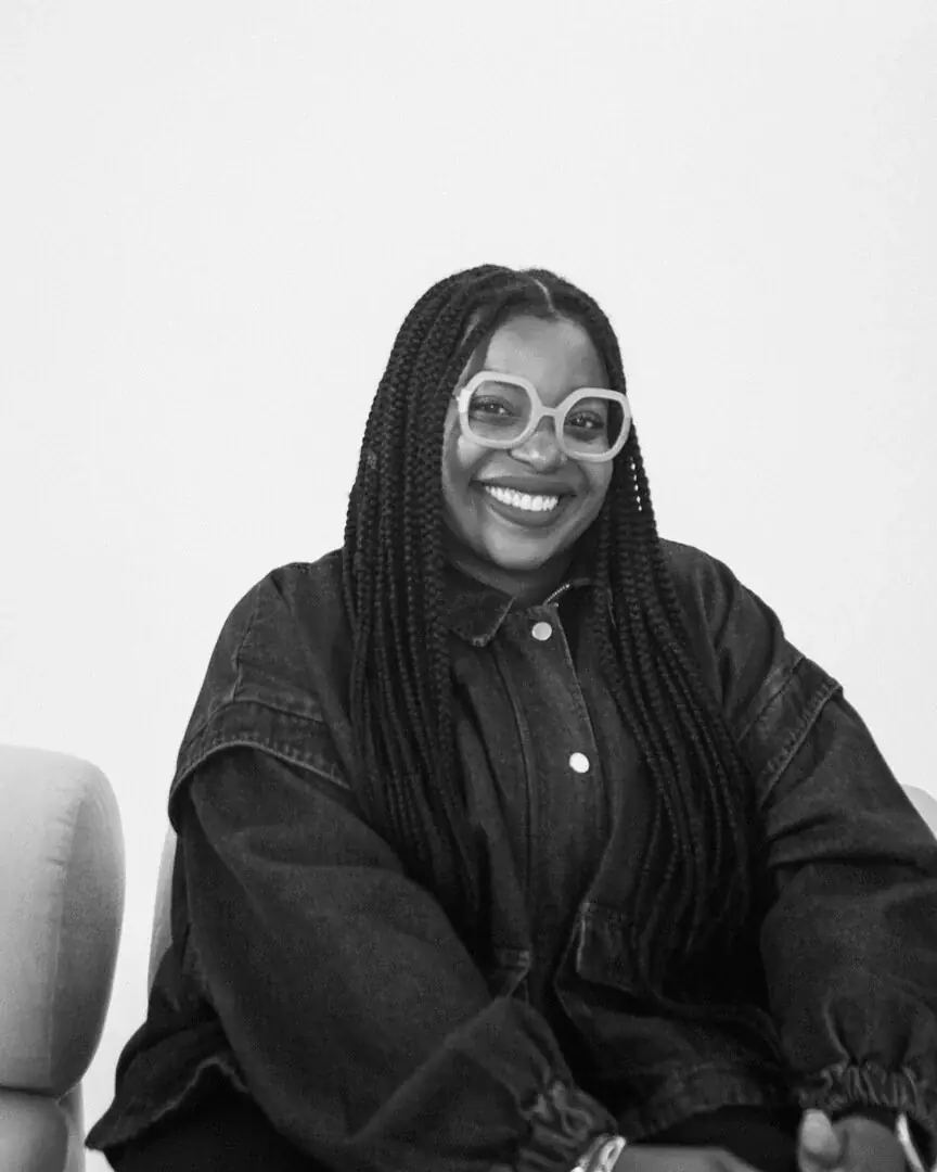 Vanessa Belleau smiling in black and white