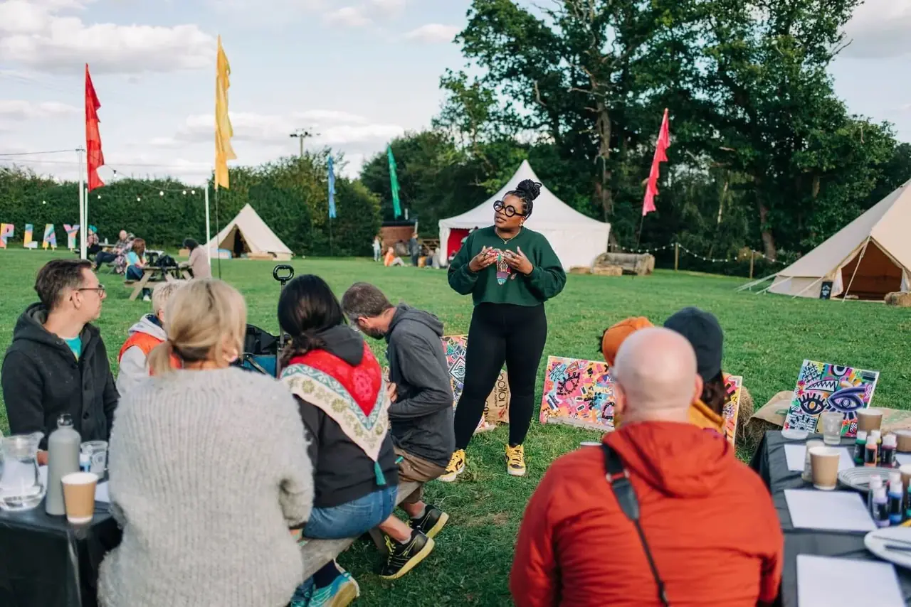 An outdoor workshop in a grassy field