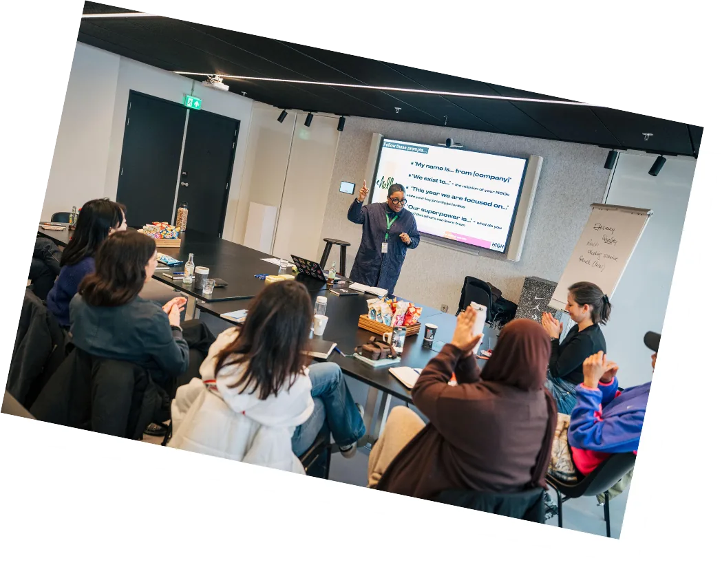 Vanessa leading a small-group workshop in a conference room